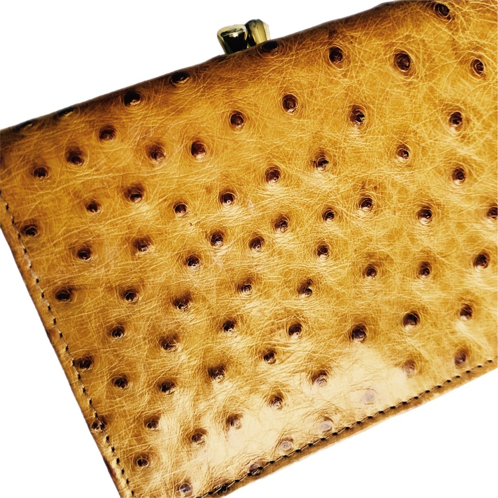 Like new gold Ostrich leather bi fold wallet 🔥